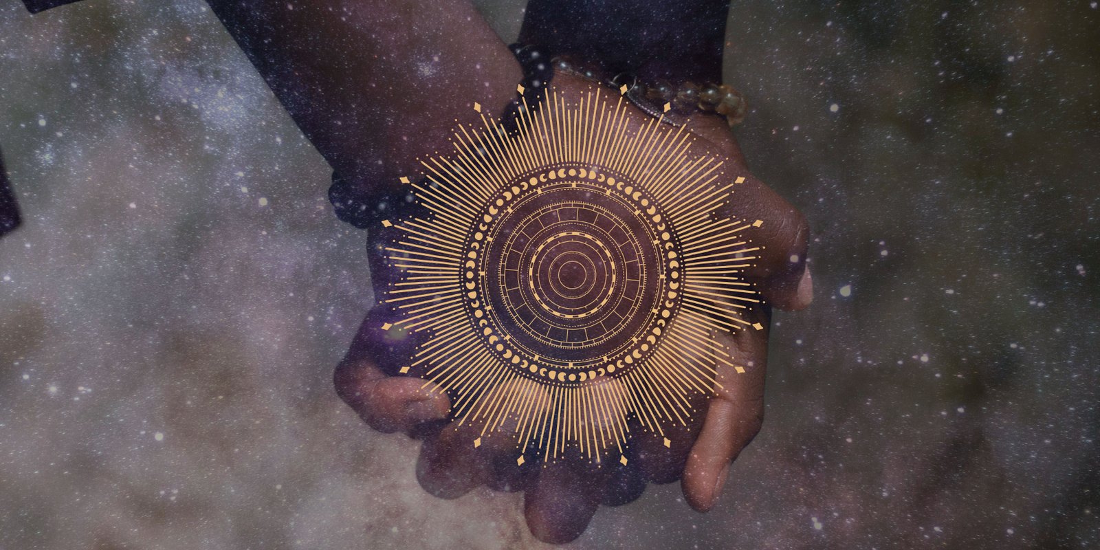 Hands holding a golden mandala