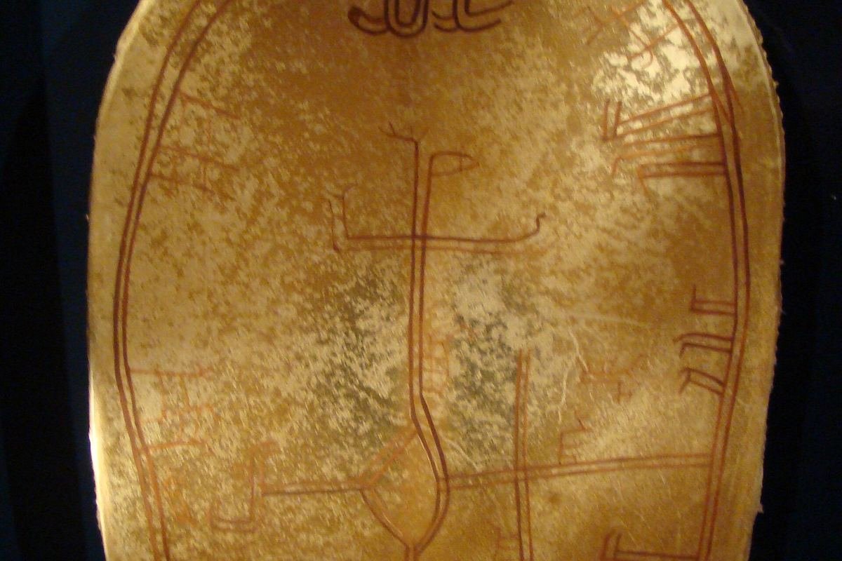 Painted Sámi shaman drum with traditional symbols, on display at the Arktikum museum in Rovaniemi, Finland