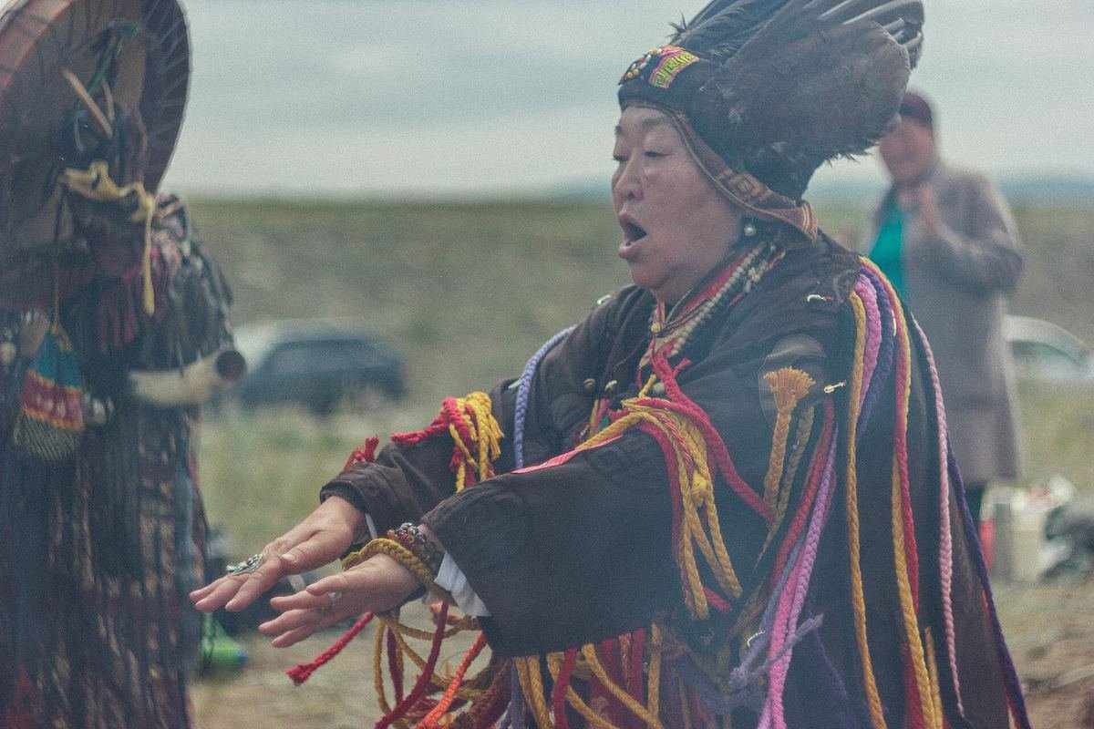 Tuvan shamans in traditional dress performing a ritual at the 2019 All-Russian Congress of Shamans in Tuva